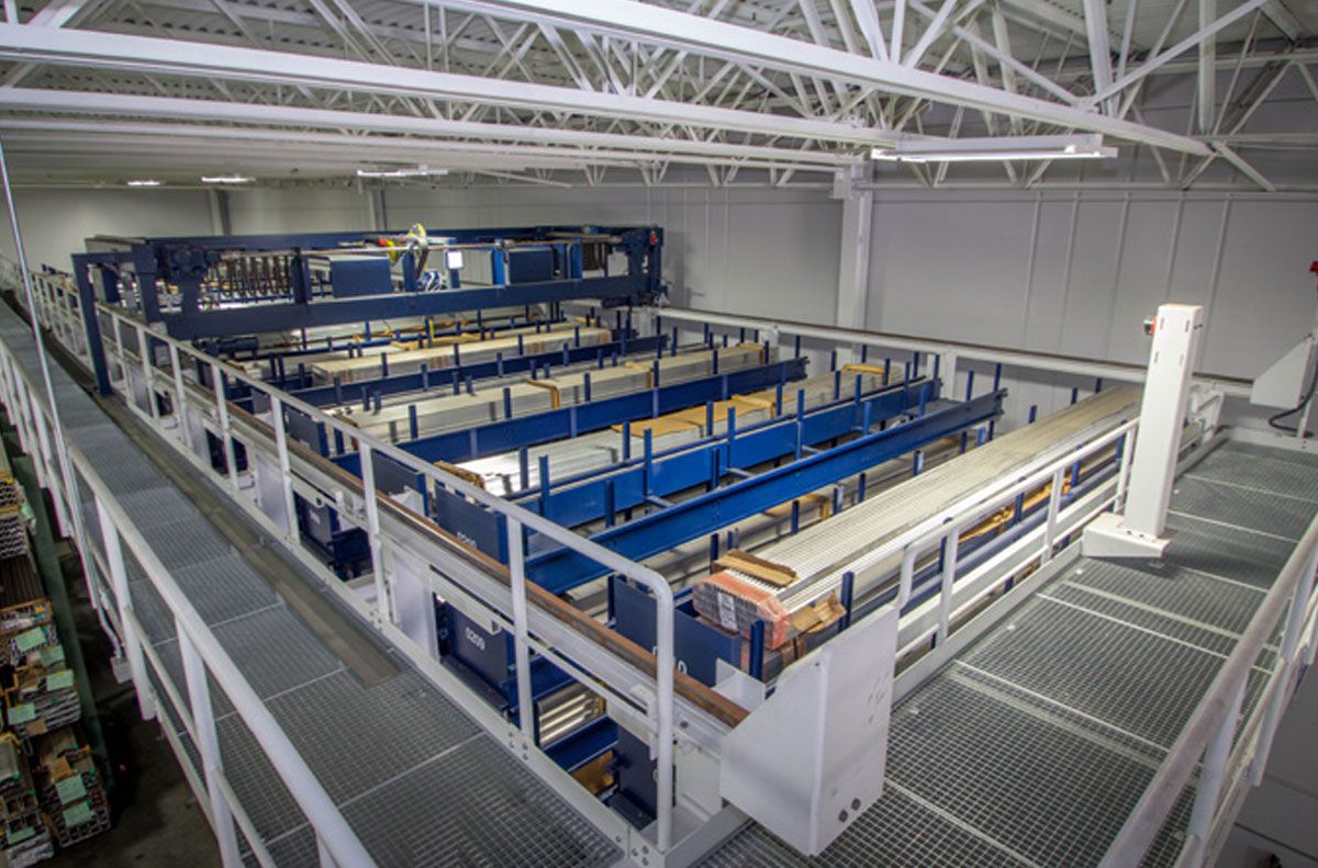 Picture: A traversing storage and retrieval machine stores and retrieves the cassettes in the twelve aisles of the long goods store.